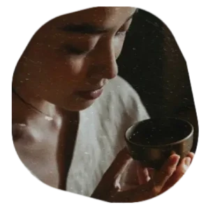 Woman attempting to drink tea or coffee