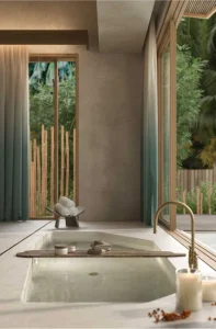 Elegant bathtub near beautiful windows.