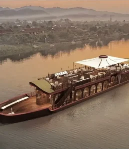 A serene floating restaurant on the river at dusk, offering a unique dining experience with a beautiful view.