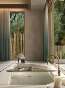 Elegant bathtub near beautiful windows.