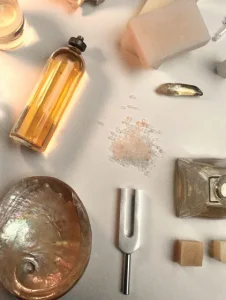 A table displaying perfume, soap, and assorted items.